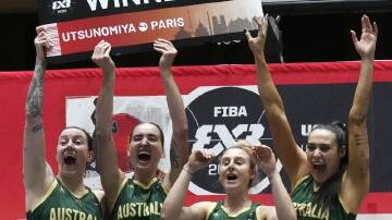 Marena Whittle, Anneli Maley, Lauren Mansfield and Alex Wilson celebrate Australia's 3x3 success. (AP PHOTO)